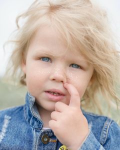 Girl with sparkles on face