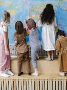 Children in front of map