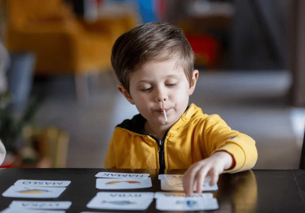 Kid Organizing Cards In ABA Therapy