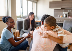 child hugging parent after session with licensed support worker autism family support services in london ontario